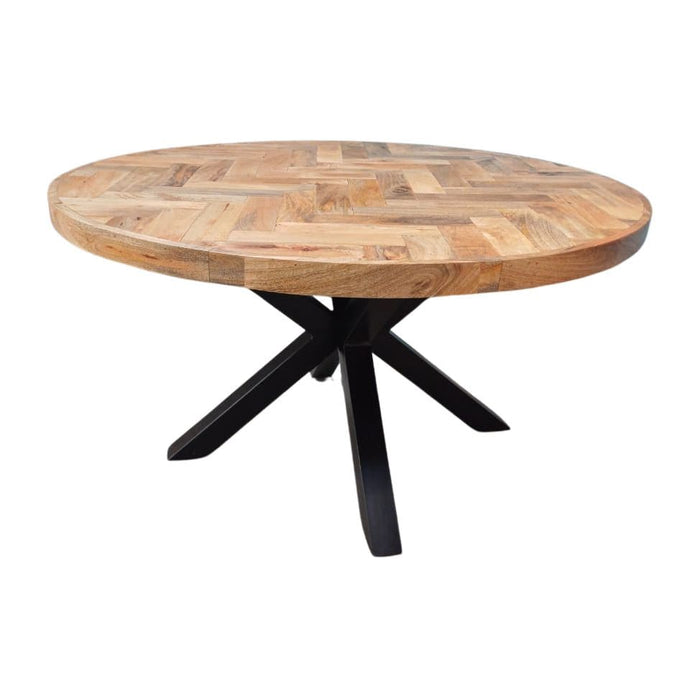 La table ronde industrielle a été fabriquée à partir d'une base en métal et d'un bois en bois massif de manguier. Mesures: 140 (L) x 140 (l) x 78 (H) cm. Kukuu, spécialiste en mobilier industriel.